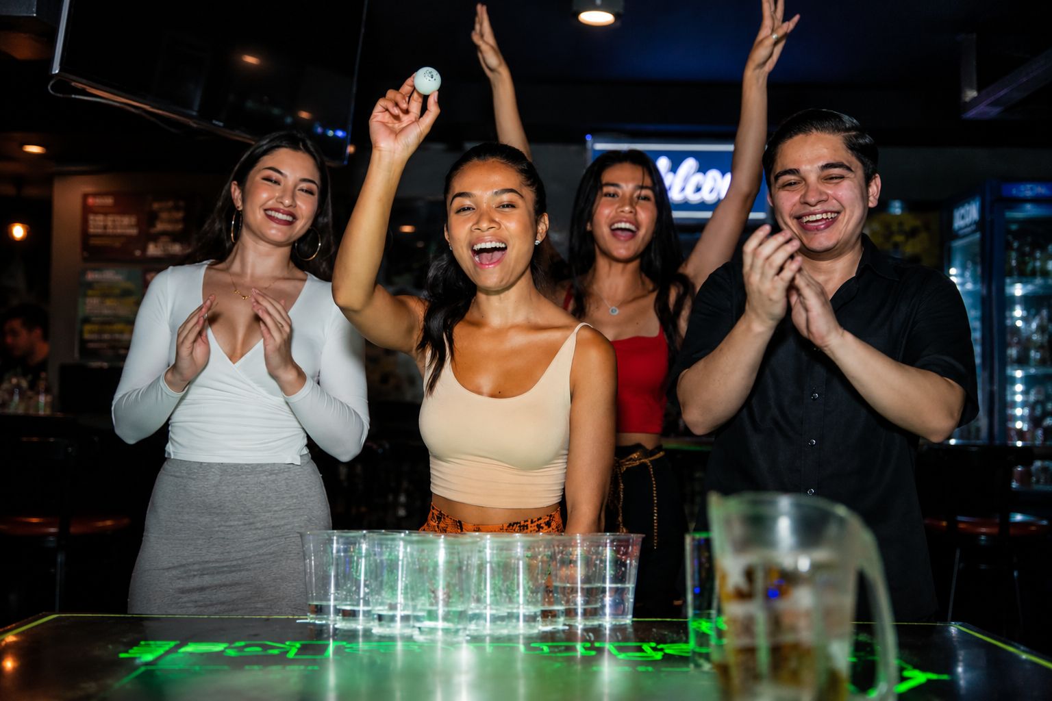 Group cheering during a beer pong game