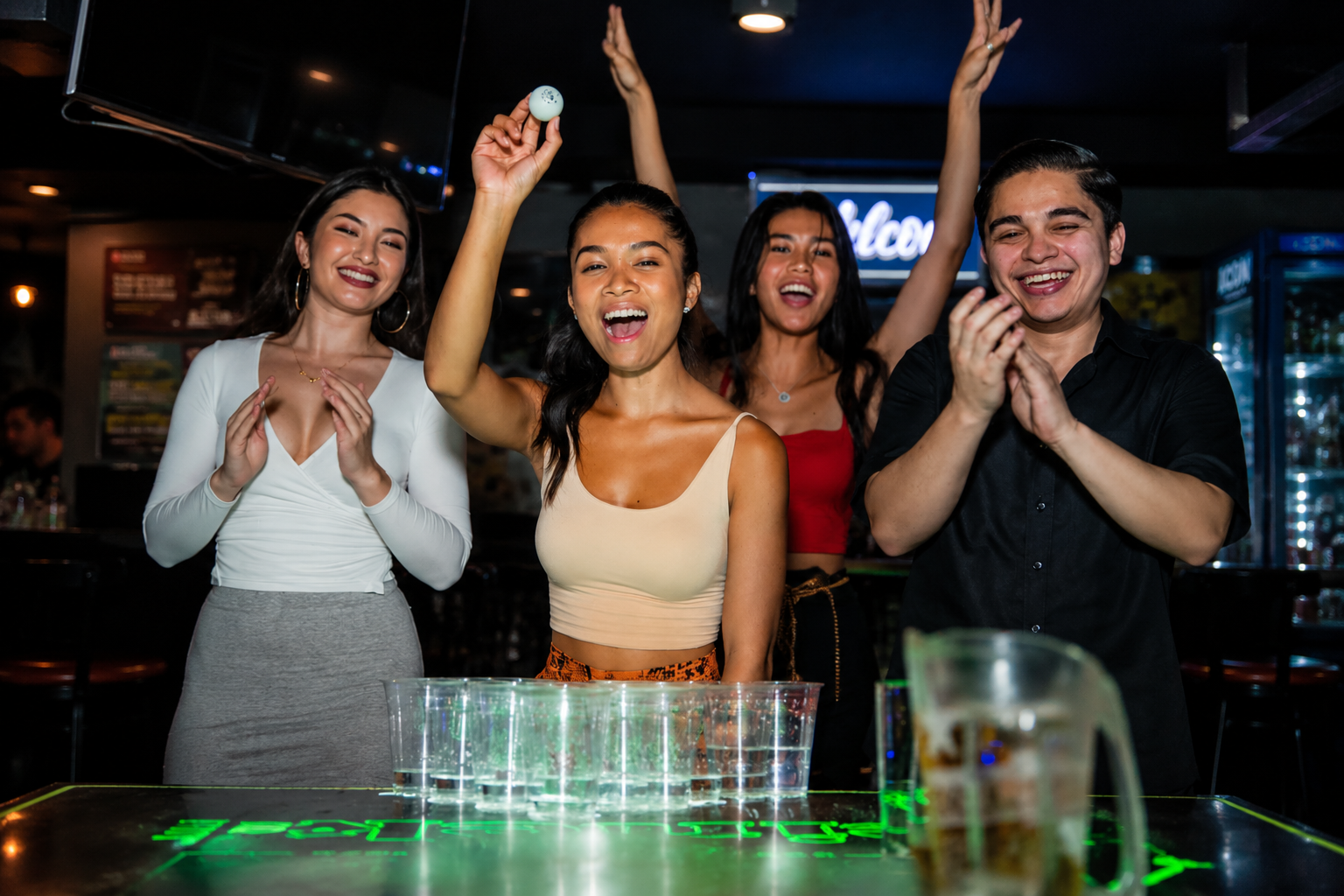 Group cheering during a beer pong game