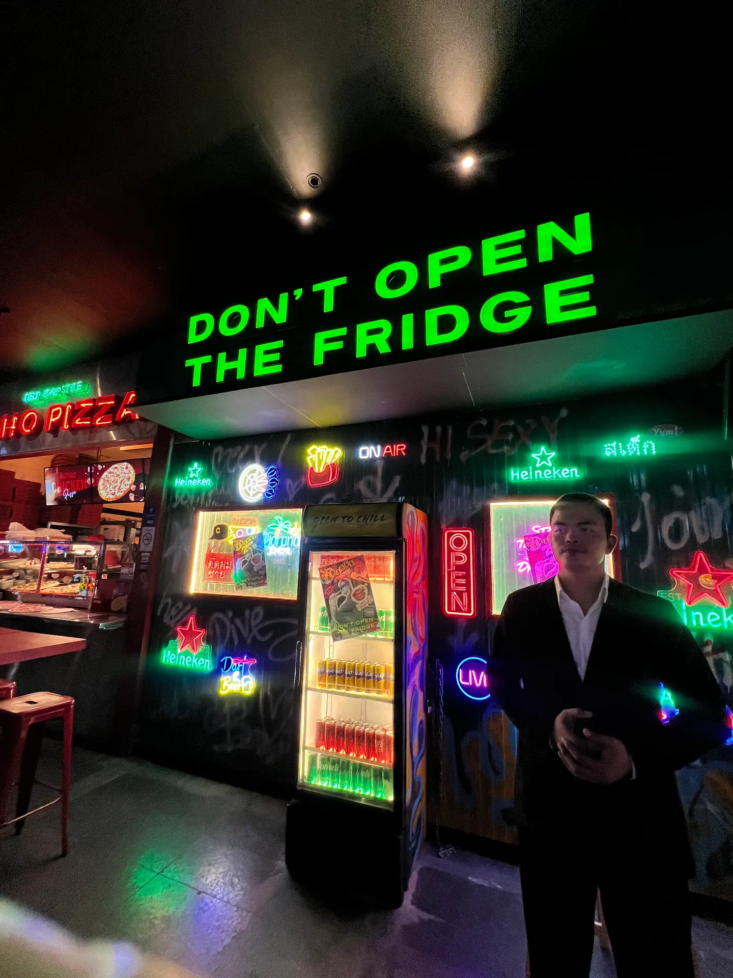 Neon-lit entrance of Don’t Open the Fridge on Soi 11