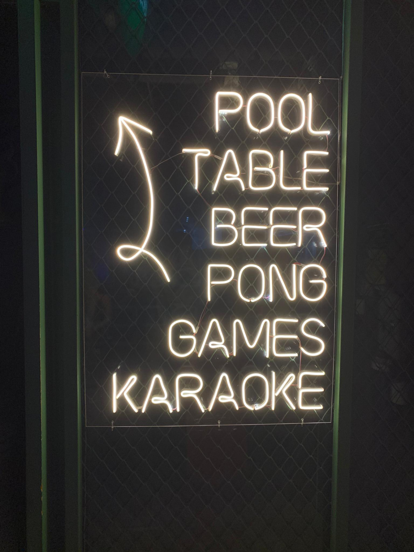 Neon sign: pool table, beer pong, games, karaoke