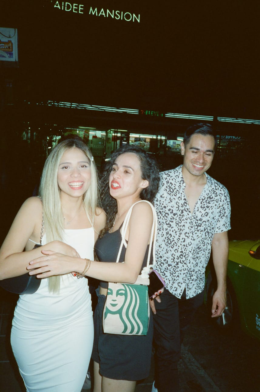 Group walking together between venues at night